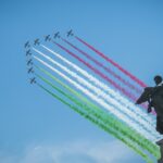 airplanes forming in V formation during daytime